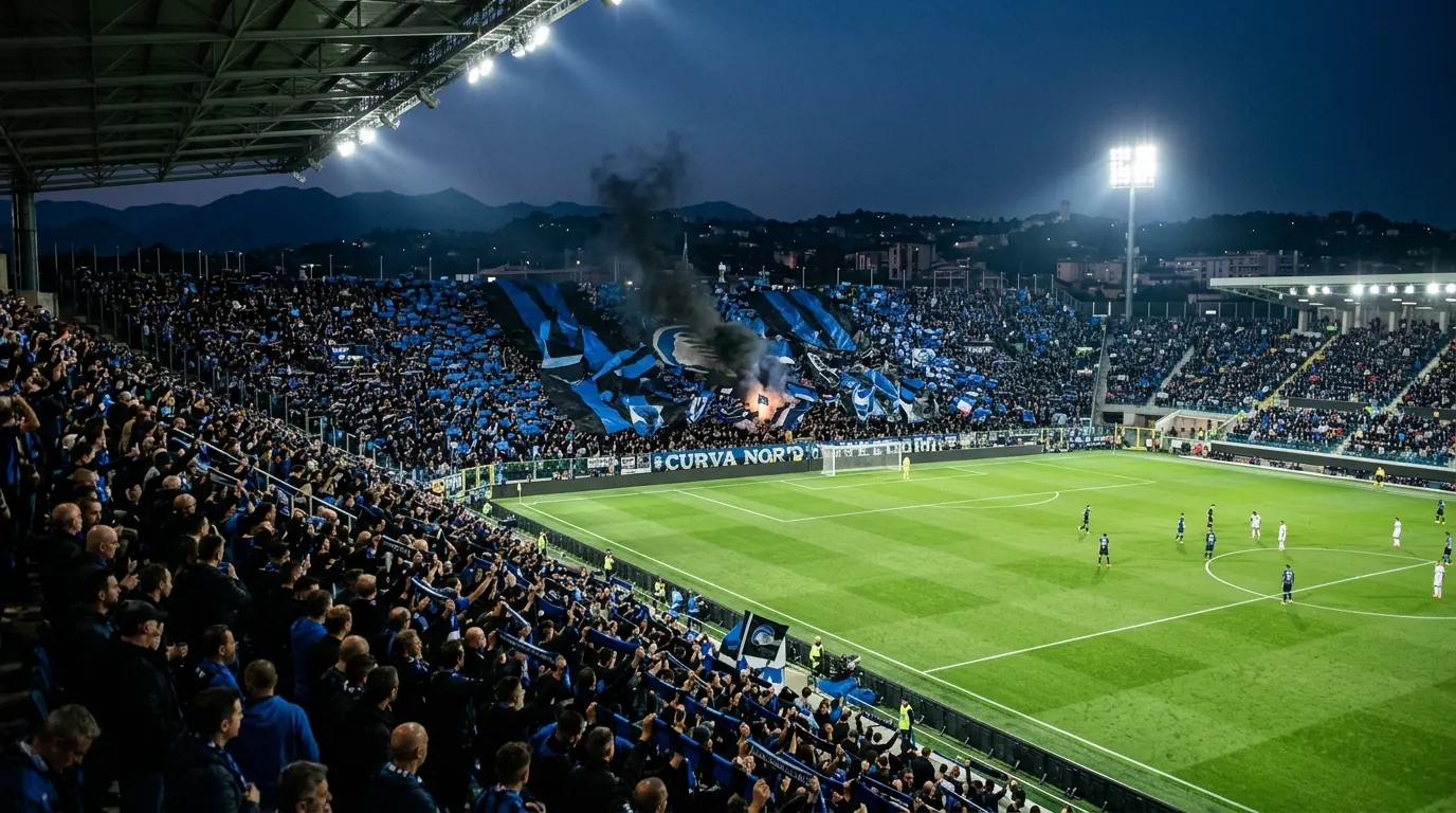 Atalanta fans in black and blue at compact Gewiss Stadium night.