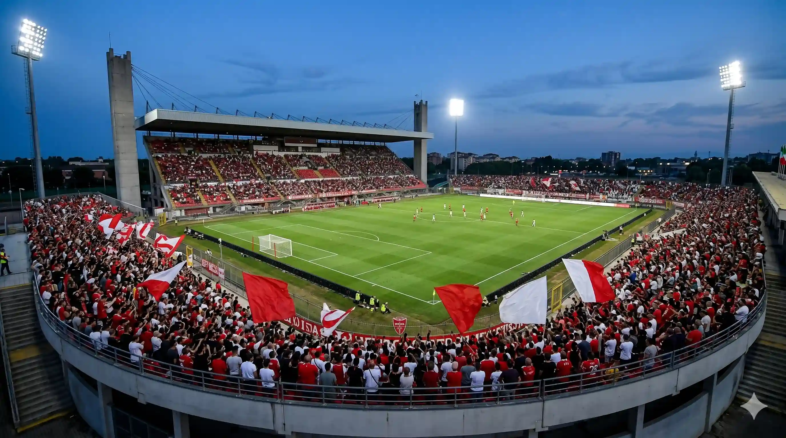 Monza fans in white and red filling the U-Power stadium night.